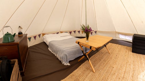 The interior of a bell tent at Brownsea Island Campsite, Dorset